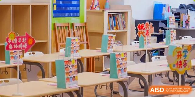 An empty classroom with desks and chairs at Shenyang International School.