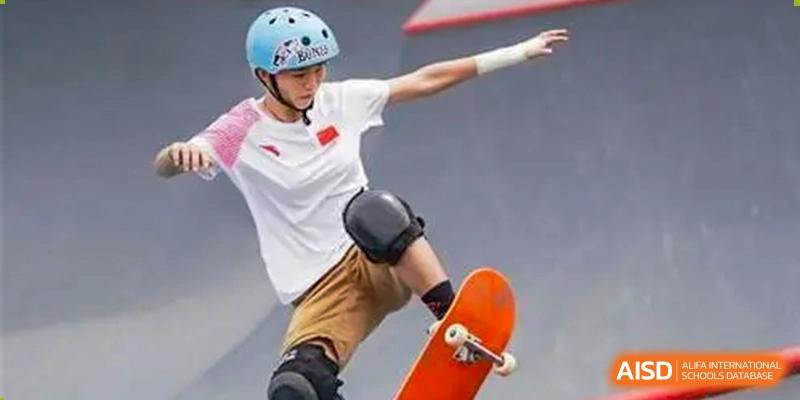 A male student is skateboarding on a ramp at Shenyang International School.