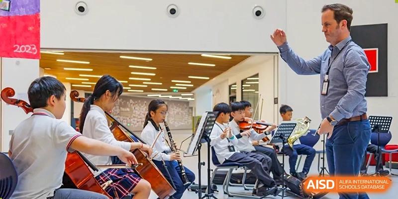 Students playing string instruments in an orchestra, SPGS International School Chengdu