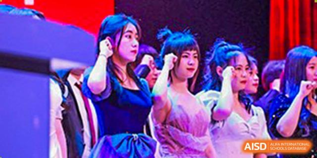 A female student singing on a stage at Huzhou South Taihu Bilingual School.