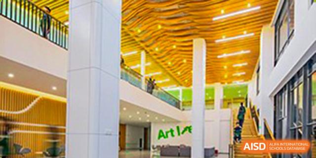 A bright, modern indoor space with the word "Art" on the wall at Huzhou South Taihu Bilingual School.
