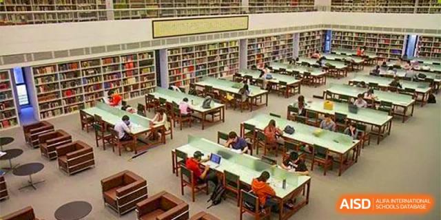 An aerial view of the library at The First High School of Changsha, Hunan, showing many students studying at long tables.