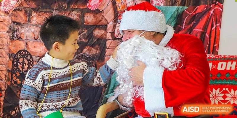 A BASIS International School Nanjing student with a long, white beard dressed as Santa Claus.