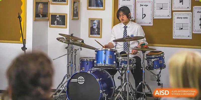 A BASIS International School Nanjing student playing the drums.