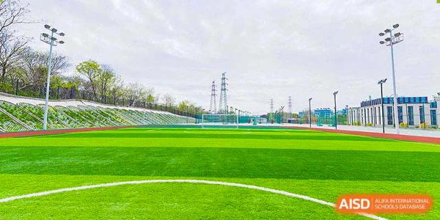 A spacious, empty sports field at BASIS International School Nanjing.