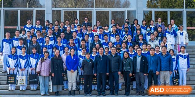 CNUH-GA Curriculum Partnership Program A large group of students and teachers standing together for a formal outdoor group photograph.