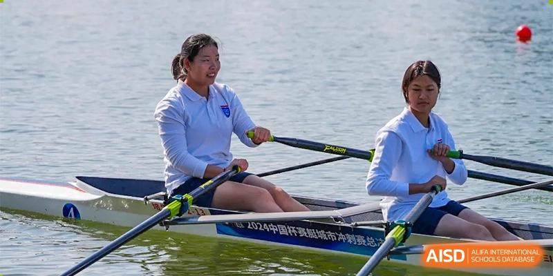 Changwai Bilingual School student in close-up, actively rowing, concentration, sport, athletic, water activity, school program.