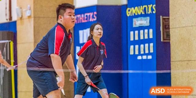 Changwai Bilingual School student playing badminton, sports, active, student life, school sports, extracurricular.