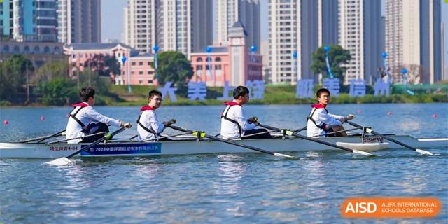 Changwai Bilingual School students rowing a boat on a lake, water sports, teamwork, school activities, outdoor, recreation.