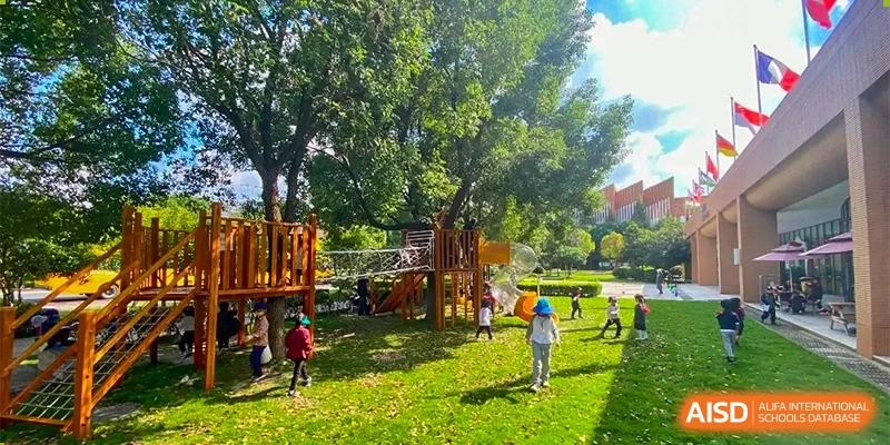 Changwai Bilingual School students playing outdoors, playground, nature, student life, fun, recreation, schoolyard, activity.