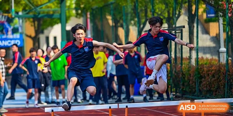 Changwai Bilingual School students playing team sport, field, active, school sports, collaboration, outdoor game, student life.