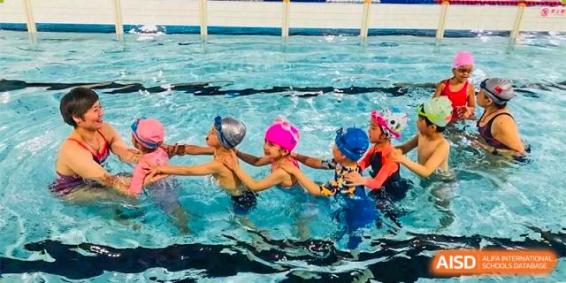 Changwai Bilingual School students playing in swimming pool, water activity, recreation, fun, school pool, aquatics.