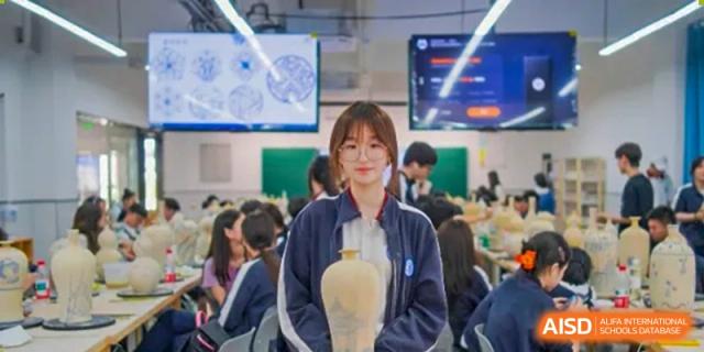 A female student with glasses and a jacket holding a trophy-like object inside a classroom or lab at the High School Affiliated to Shanghai Jiao Tong University.