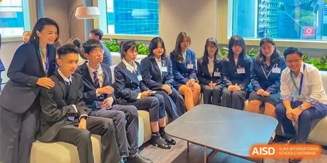 Guangdong Overseas Chinese High School International Curriculum students seated together in an informal setting for a class or small group discussion.