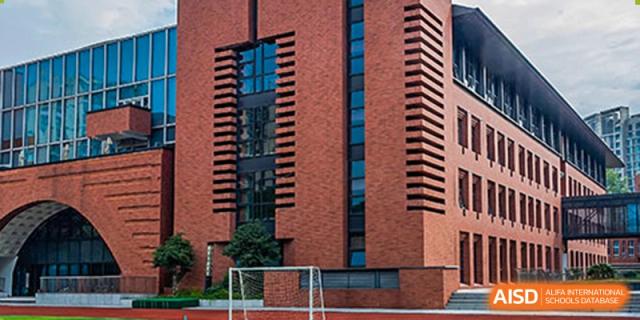 A close-up of the red brick exterior of a building at Wahaha Bilingual School Hangzhou.