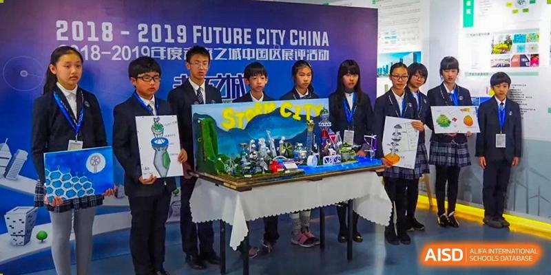 Students at Wahaha Bilingual School Hangzhou are presenting a project at an event with a banner that says 'Future City China.'