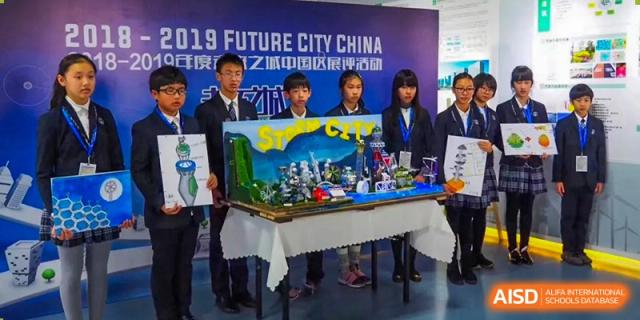 Students at Wahaha Bilingual School Hangzhou are presenting a project at an event with a banner that says 'Future City China.'