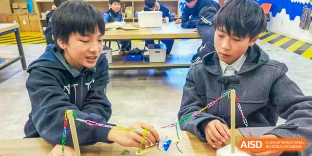 Students from Shanghai United International School Hefei Campus working on a hands-on project.
