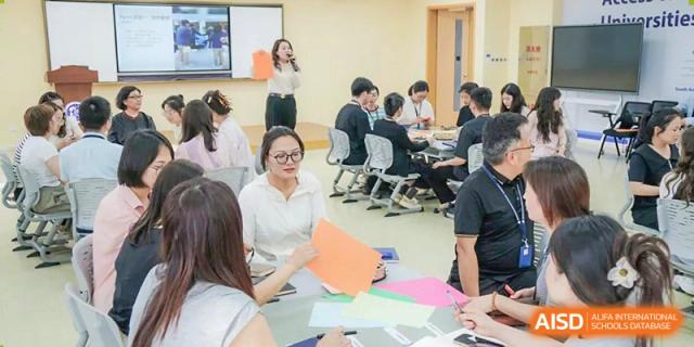 A teacher from Shanghai United International School Hefei Campus interacting with a student.