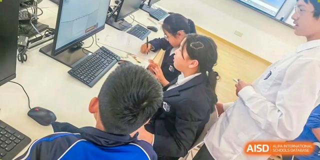 Students from Shanghai United International School Hefei Campus collaborating on a digital project.