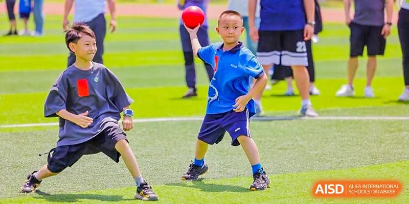 A student from Shanghai United International School Hefei Campus playing a sport on a field.