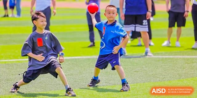 A student from Shanghai United International School Hefei Campus playing a sport on a field.