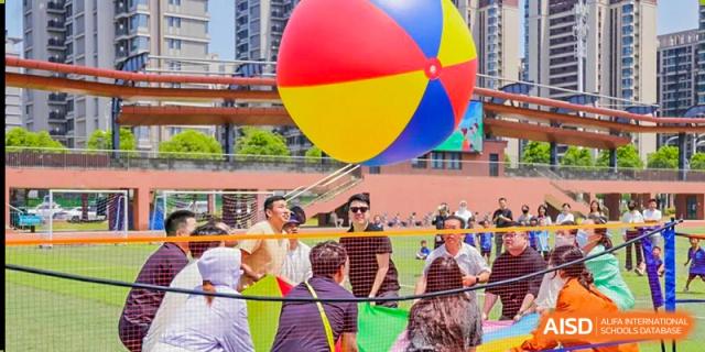 A group of students from Shanghai United International School Hefei Campus performing a dance outdoors.