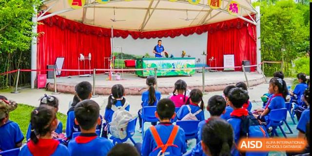 Students from Shanghai United International School Hefei Campus attending an outdoor assembly or event.
