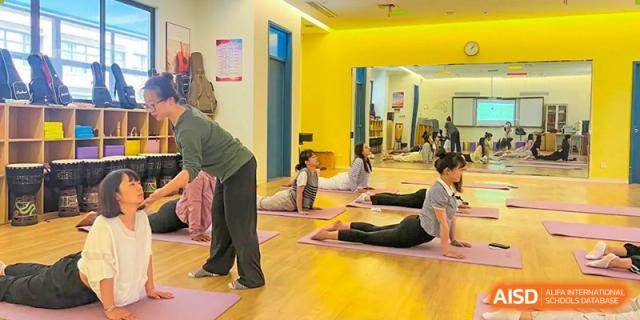Students from Shanghai United International School Hefei Campus practicing yoga.