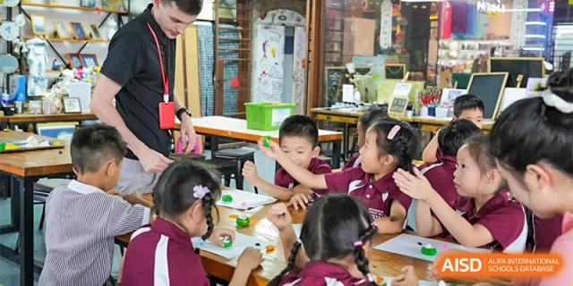 A classroom of young students engaged in a hands-on art or craft activity at Bromsgrove School Mission Hills.