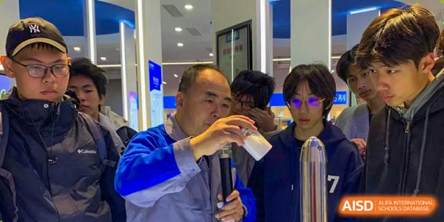 A Qingdao Cornerstone Bilingual School teacher demonstrating an experiment to students.
