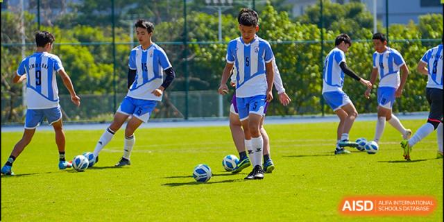 A close-up shot of students from Tsinglan School on a soccer field during a game.