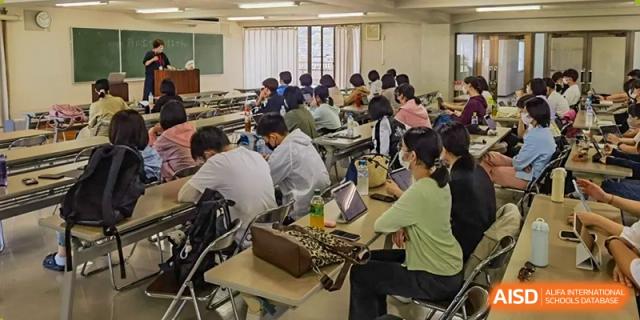Students from Northeast Yucai Foreign Language School are working together in a science class.