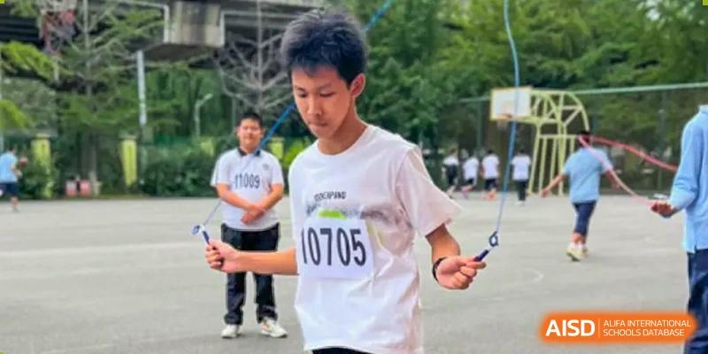 A student from Northeast Yucai Foreign Language School with a race bib jumps rope during a competition.