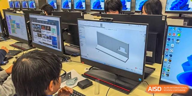 A computer screen at Shanghai Foreign Language School Affiliated to SISU displaying a 3D CAD drawing or technical design in a design class.