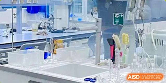 A view of a well-equipped science lab bench with glassware and equipment at Shanghai Foreign Language School Affiliated to SISU.
