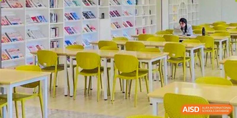 A contemporary classroom or study hall with bright yellow chairs and white tables, a learning space at the Shanghai Foreign Language School Affiliated to SISU.