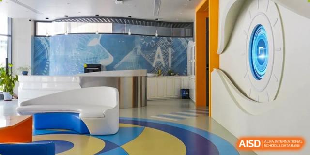 This shows a modern, bright study area with curved walls and colorful flooring at Shanghai Shangde Experimental School.