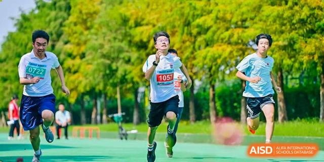 A student from Suzhou North America High School is running in a race, wearing a bib with the number 1057.