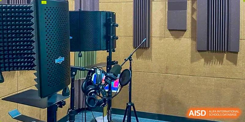 A professional recording studio setup with a microphone and headphones at Suzhou North America High School.