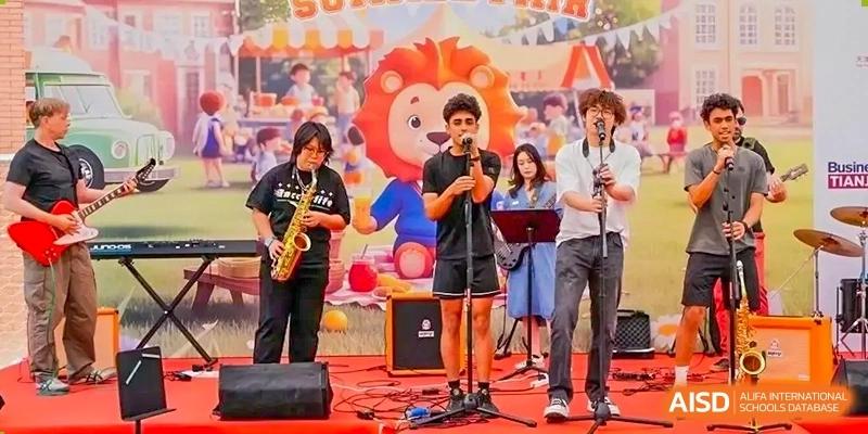 Two male students from Wellington College International Tianjin perform on a stage with a saxophone and a microphone.
