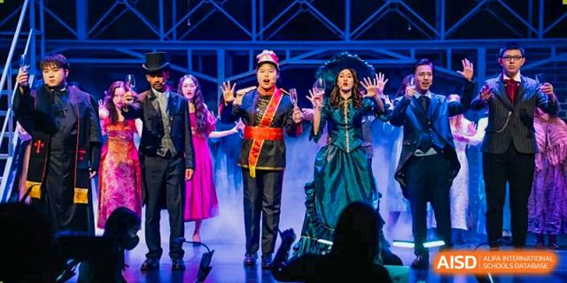 Wellington College International Tianjin students perform a scene from a play, dressed in elaborate costumes.