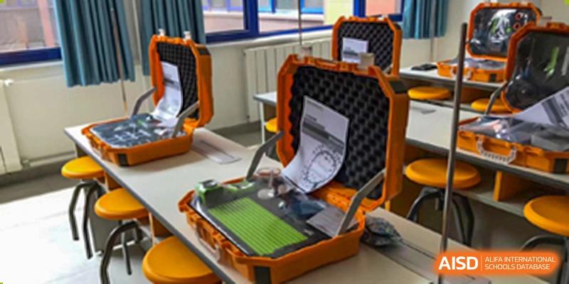Close-up of specialized equipment and instructions in an orange protective case at Yang Guang Qing International School of Beijing.