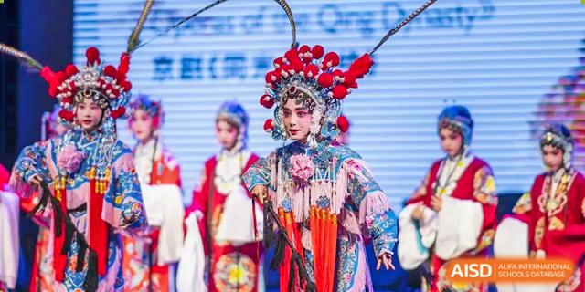 A Huili School Shanghai student performing in full traditional costume and makeup for a Peking Opera event.