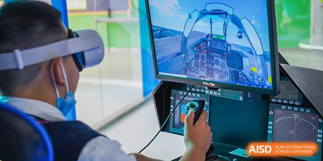 A student at Shenzhen Foreign Languages GBA Academy using a stylus on a large interactive screen for a virtual reality or design project.