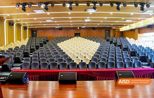 Rows of empty chairs set up in an auditorium for an event at Shenzhen Foreign Languages GBA Academy.