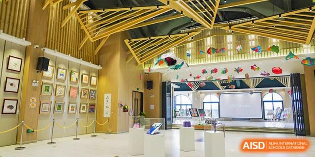 An indoor space with hanging fish decorations and modern seating at Shenzhen Foreign Languages GBA Academy.