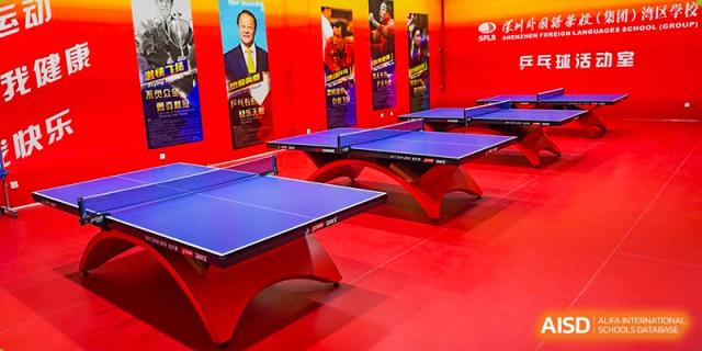 Two ping pong tables in a brightly lit recreation room at Shenzhen Foreign Languages GBA Academy.