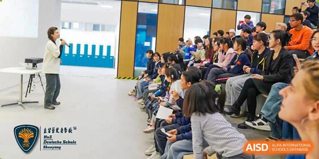Students at HuZ Deutsche Schule Shenyang sitting in an audience for a school event.