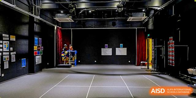 A view of a stage and a performance area at Overseas Chinese Academy of Chiway Suzhou.